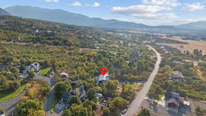 Aerial overview of property's location featuring mountains
