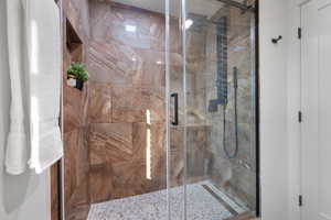 Full bathroom with a stall shower