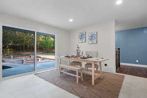 Dining space featuring recessed lighting and light tile patterned flooring