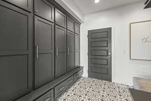 Mudroom featuring light tile patterned flooring and recessed lighting