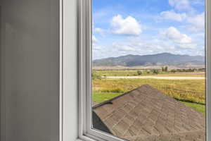 View of mountain backdrop with rural landscape