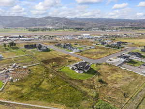 View of property location featuring a mountain backdrop and nearby suburban area