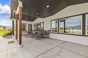 View of patio / terrace with a mountain view and outdoor dining space