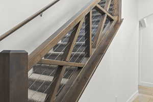 Stairs with wine cooler and baseboards