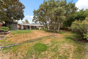 View of yard with a patio