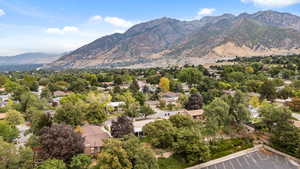 View of mountain backdrop featuring nearby suburban area