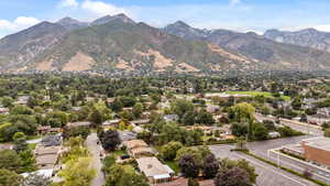 Aerial view of residential area featuring a mountain backdrop
