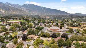 Aerial view of residential area featuring mountains