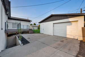 Detached garage featuring driveway