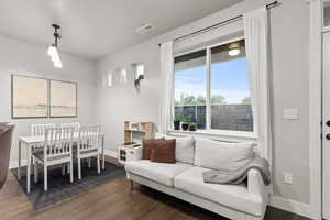Dining room with dark wood-style floors