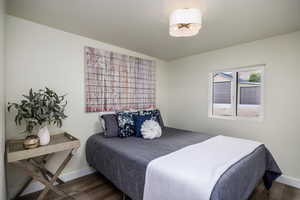Bedroom with wood finished floors