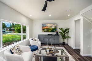 Living room featuring recessed lighting, dark wood finished floors, and a ceiling fan
