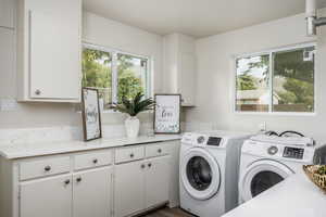 Washroom with independent washer and dryer and cabinet space