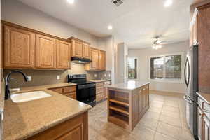 Kitchen featuring open shelves, recessed lighting, black electric range oven, a kitchen island, and backsplash