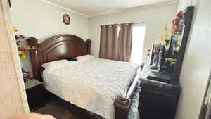 Bedroom featuring ornamental molding