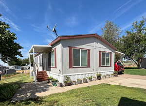 View of home's exterior featuring a yard