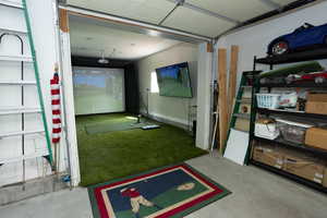 Recreation room with golf simulator