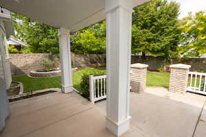 Fenced backyard featuring a patio