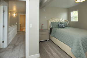 Bedroom featuring light colored carpet