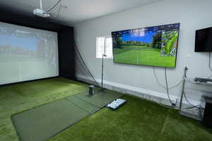 Recreation room featuring golf simulator and carpet floors