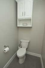 Bathroom with baseboards and toilet