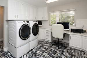 Washroom with independent washer and dryer, a desk, and cabinet space