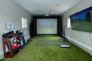 Playroom featuring golf simulator and carpet flooring