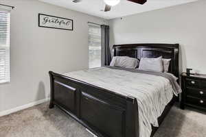 Bedroom featuring carpet and a ceiling fan