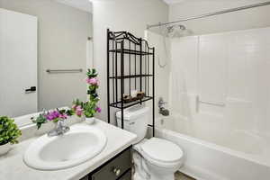 Full bathroom with tub / shower combination and vanity