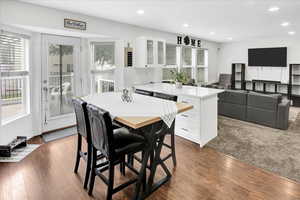 Dining room with recessed lighting and dark wood finished floors
