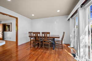 Dining room featuring wood finished floors and recessed lighting