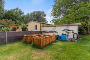 Back of property with a garden