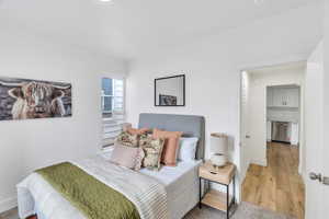 Bedroom with baseboards and light wood-style flooring