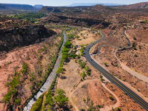 Aerial view of property's location with a mountainous background and rural landscape