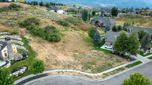 Aerial perspective of suburban area with a mountainous background