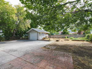 Detached garage featuring driveway