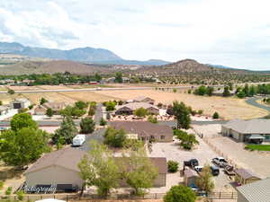 Aerial perspective of suburban area featuring a mountainous background