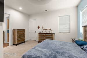 Bedroom featuring light carpet, recessed lighting, and ceiling fan