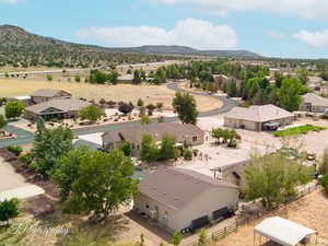 Overview of rural landscape featuring nearby suburban area and mountains