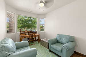Office space featuring a textured ceiling and a ceiling fan