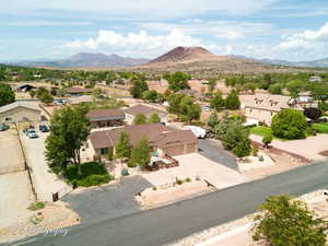 Aerial view of residential area featuring mountains