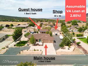 Aerial perspective of suburban area with a mountainous background