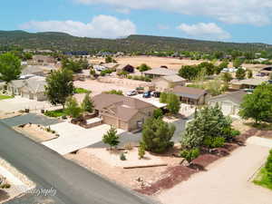 Aerial perspective of suburban area featuring a mountain backdrop