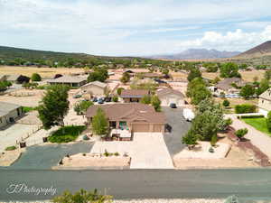 Aerial perspective of suburban area with a mountain backdrop