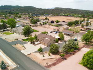 Aerial perspective of suburban area with a mountainous background