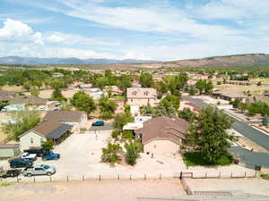 Aerial view of residential area featuring a mountainous background