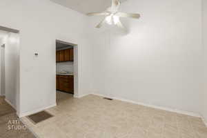 Spare room with baseboards and ceiling fan