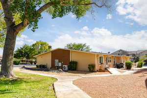 Back of house with brick siding
