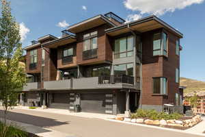 View of property featuring an attached garage