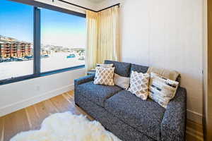 Living area featuring baseboards and wood finished floors